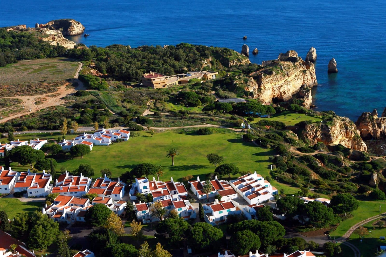 Prainha Beach Village from the air, with the clifftop and Praia dos Três Irmãos